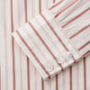 View 3 of product The Pink and Sandstone Stripe Cotton Regular Fit Mayfair Shirt by Turnbull & Asser features vertical pink and sandstone stripes on white, a T&A collar, wide cuffs, and a slightly curved hem for refined detail.