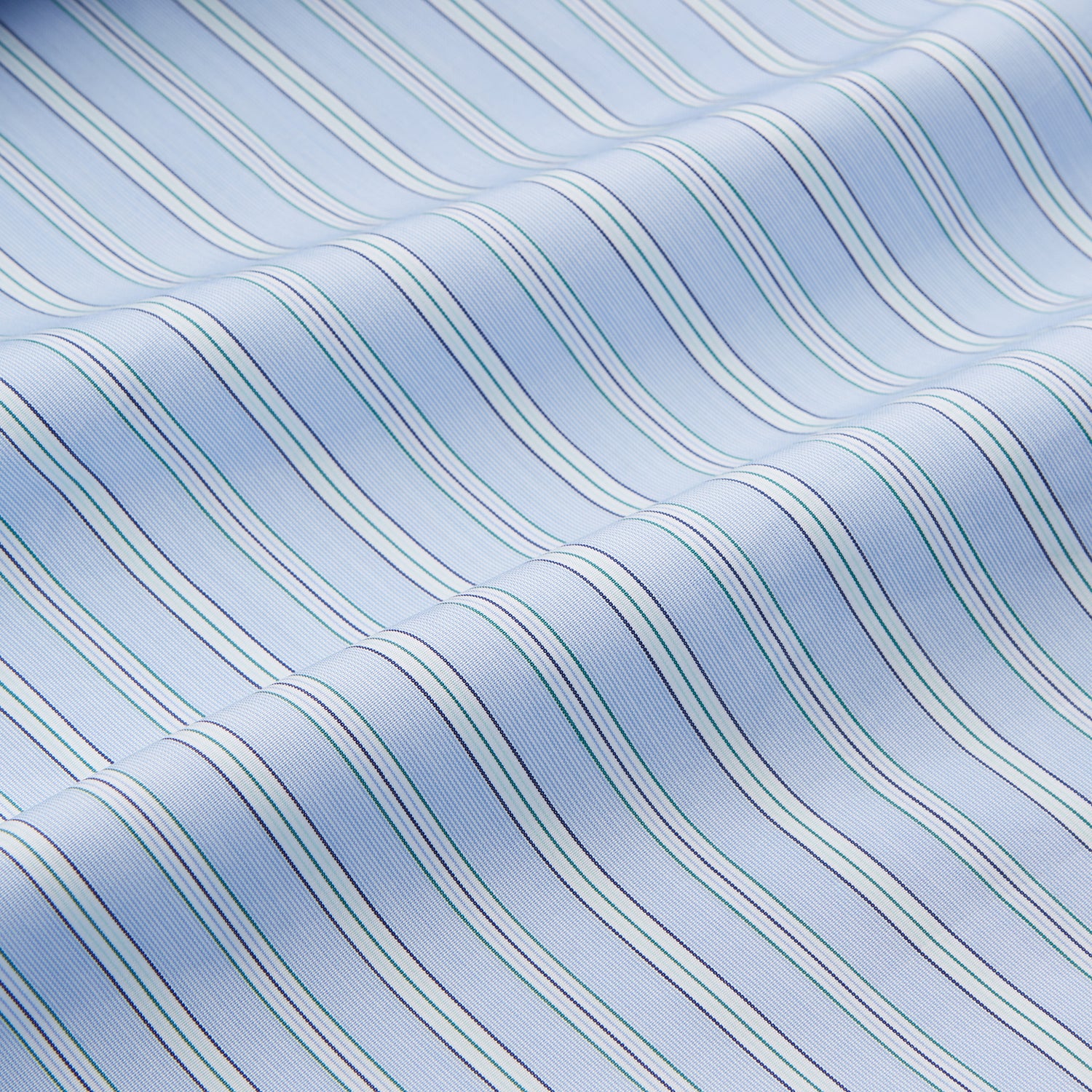 View 4 of product The Turnbull & Asser Blue and Green Stripe Poplin Cotton Nightshirt features long sleeves, a rounded hem, front pocket, green-trimmed collar and pocket, and front buttons—ideal men's nightwear for any season.