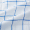 View 6 of product The Turnbull & Asser Colony Blue Grid Check Mayfair Shirt features long sleeves, a button-down front, Italian cotton fabric, a spread collar, and buttoned cuffs, shown against a plain white background.