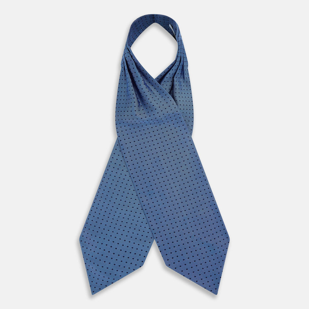 The Turnbull & Asser Navy and Blue Micro Dot Silk Cravat, featuring a refined dot pattern, makes an elegant statement when paired with a matching pocket square, showcased here against a white background.