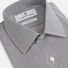 View 2 of product The Turnbull & Asser Navy Fine Stripe Mayfair Shirt, a long-sleeve, button-up with a classic collar, features fine navy stripes and white buttons, shown laid flat on a white background.