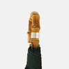 View 3 of product The Turnbull & Asser Forest Green Telescopic Umbrella with a whangee crook handle is opened and displayed on a plain white background, highlighting its expert craftsmanship and timeless style.