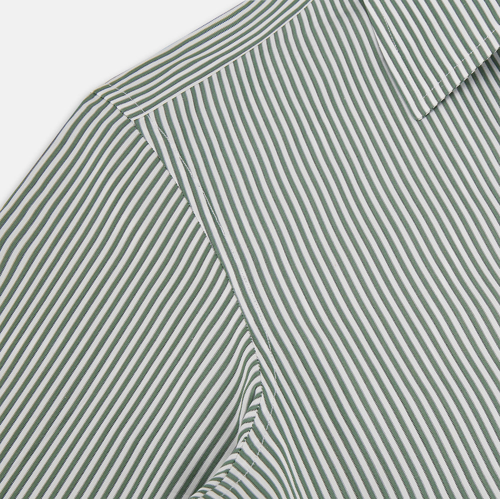 The Melon Green Halo Stripe Westminster Shirt by Turnbull & Asser, featuring thin green and white stripes and a classic Turnbull collar, is displayed against a plain white background—a testament to refined British craftsmanship.