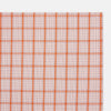 View 2 of product The Turnbull & Asser Hand Rolled Orange Graph Overlay Check Handkerchief features bold orange and white checks with blue and orange grid lines—a refined, classic accessory for any gentleman.