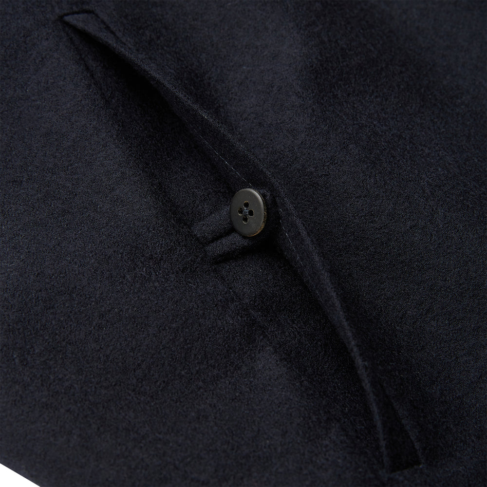 The Turnbull & Asser Navy Single-breasted Waistcoat is a sleeveless wool-cashmere piece with a small chest pocket and two side pockets, shown against a white background—an ideal addition to your winter wardrobe.