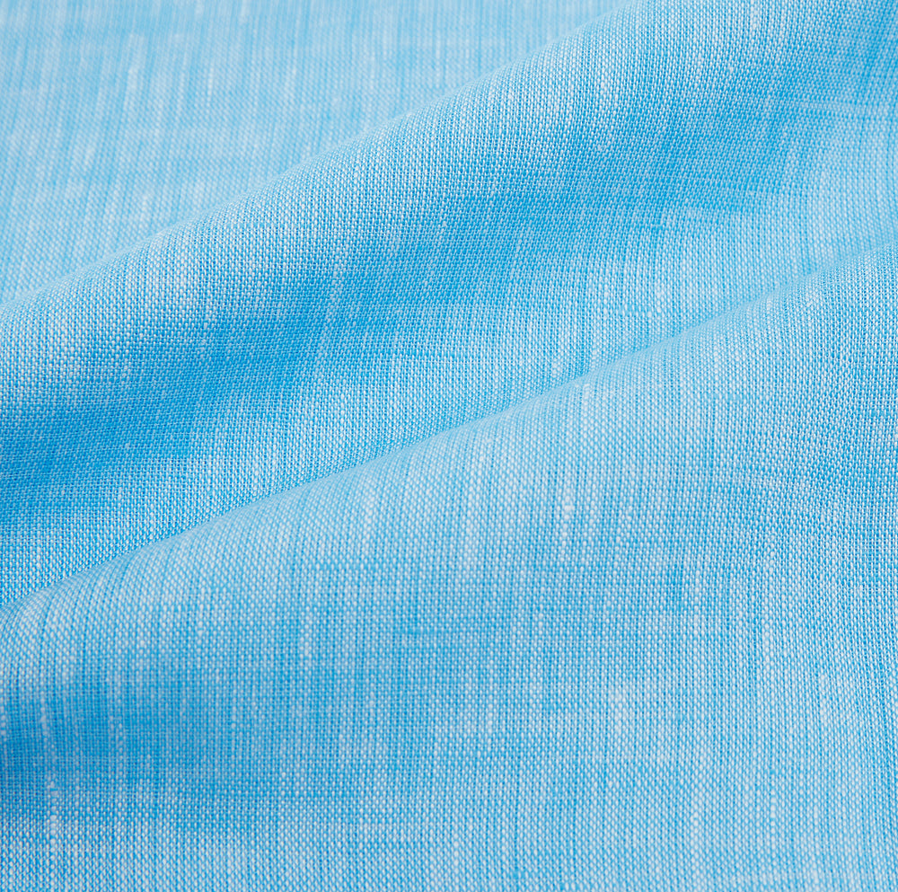 The Turnbull & Asser Turquoise Linen Mayfair Shirt features long sleeves and a collar, displayed neatly on a white background.