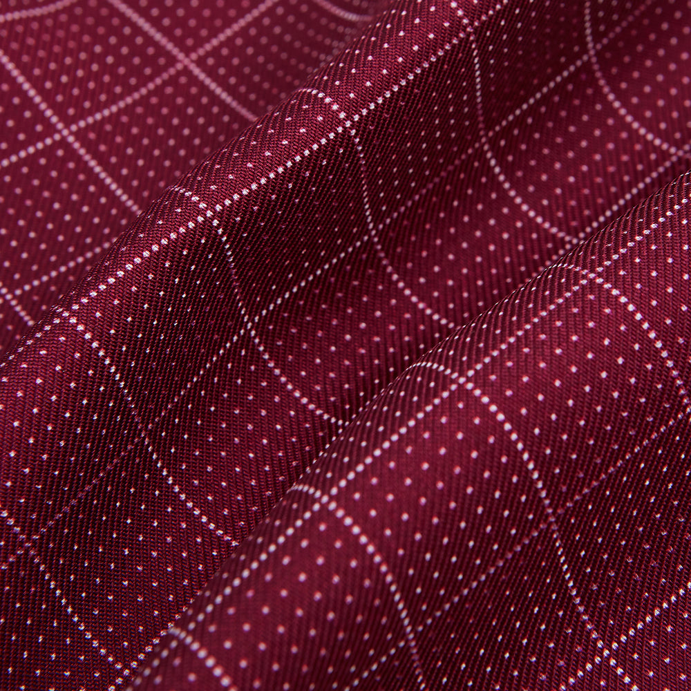 The Turnbull & Asser Burgundy Dotted Check Pattern Printed Silk Cravat, shown on a white background, features a refined British design perfect for elevating your look.