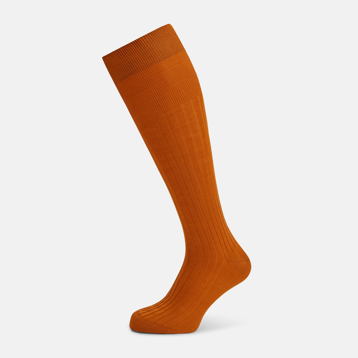 View 1 of product Turnbull & Asser Pumpkin Long Socks shown on a foot; bright orange and over the calf in length.