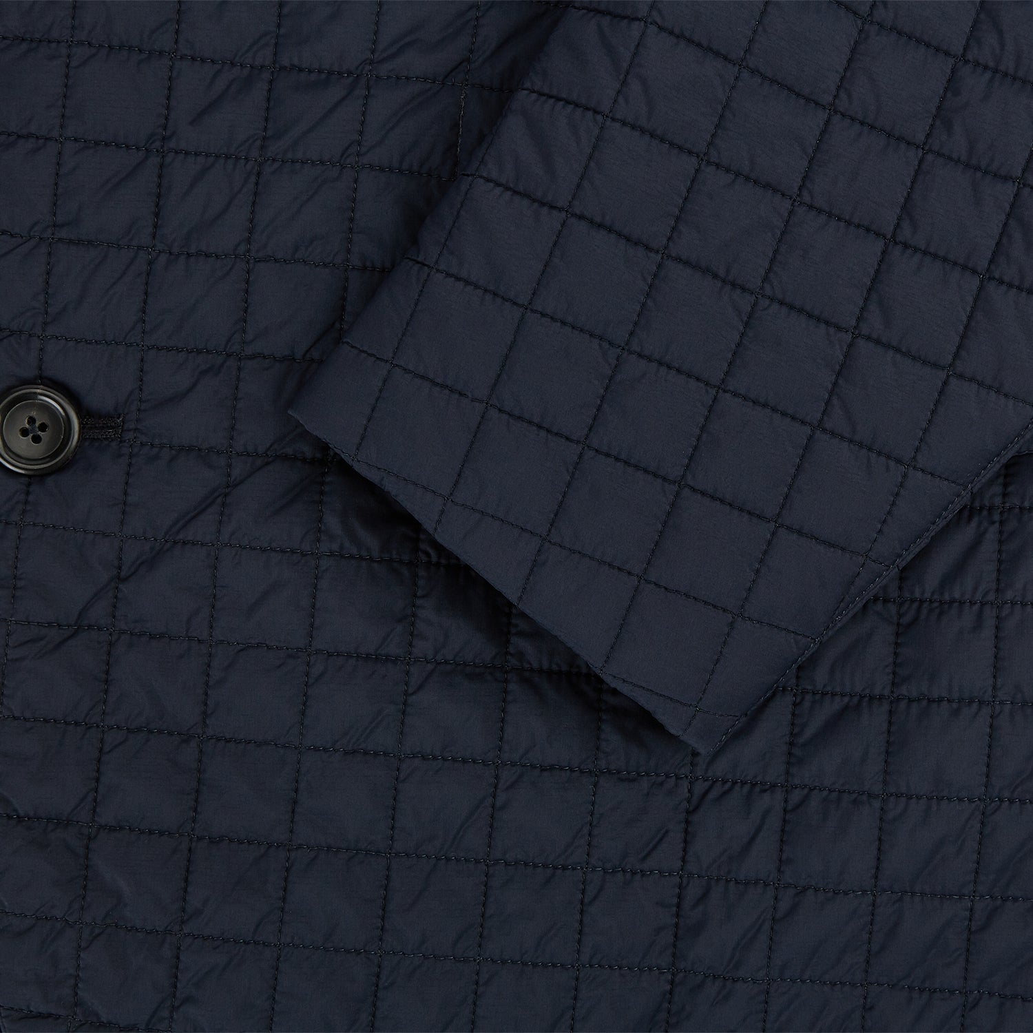 Image 4 of product The Fulham Navy Single-Breasted Quilted Blazer by Turnbull & Asser features a notched lapel, three black buttons, a chest pocket, and two front flap pockets. Shown on a plain white background—ideal for the modern gentleman.