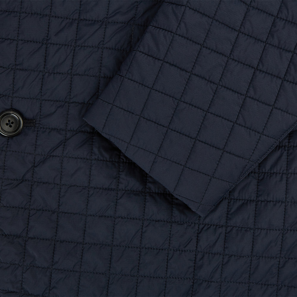 The Fulham Navy Single-Breasted Quilted Blazer by Turnbull & Asser features a notched lapel, three black buttons, a chest pocket, and two front flap pockets. Shown on a plain white background—ideal for the modern gentleman.