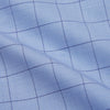 View 5 of product The Blue Prince of Wales Check Mayfair Shirt by Turnbull & Asser is a light blue formal long-sleeve shirt with a subtle check pattern, button-down front, and buttoned cuffs, shown laid flat on a white background.