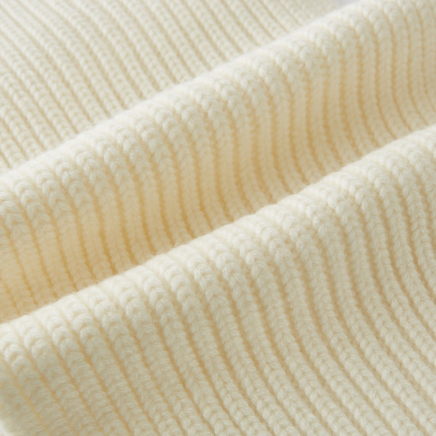 Image 3 of product The Turnbull & Asser Ivory Rib-Knit Cashmere Scarf is tied in a simple loop, showing off its textured finish against a plain white background.