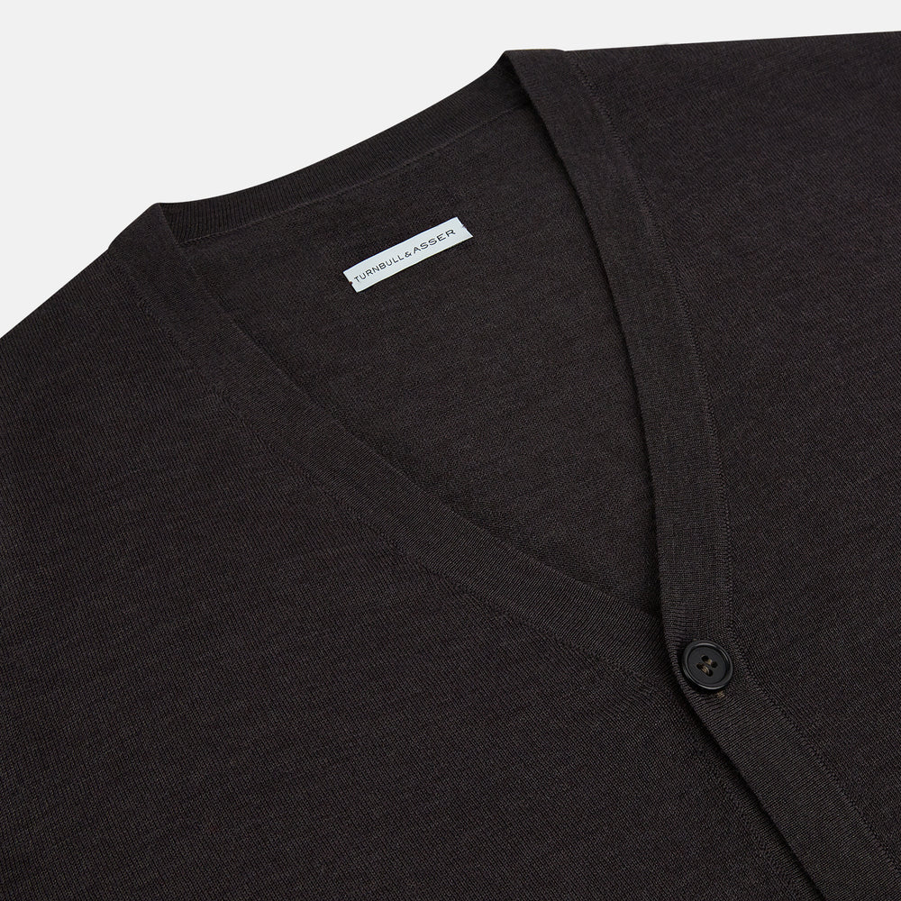 The Turnbull & Asser Brown Fine Merino V-Neck Cardigan is a classic, long-sleeved button-up knitwear piece, shown on a white background—a wardrobe essential.