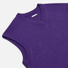 View 2 of product The Turnbull & Asser Purple Fine Merino V-Neck Vest is a sleeveless gentleman’s sweater with a ribbed collar, shown against a plain white background.