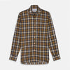View 2 of product Close-up of Turnbull & Asser’s Yellow Check Cotton Fabric, highlighting its intersecting black, yellow, white, and gray lines in a plaid pattern, displayed within a circular frame on a plain light background.