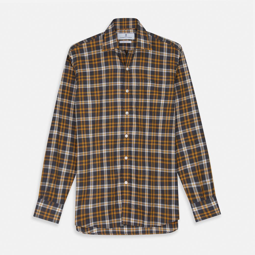 Close-up of Turnbull & Asser’s Yellow Check Cotton Fabric, highlighting its intersecting black, yellow, white, and gray lines in a plaid pattern, displayed within a circular frame on a plain light background.