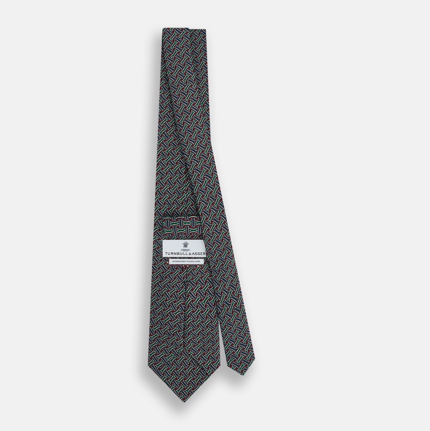 View 4 of product The Forest Green and Red Weave-Patterned Printed Silk Tie by Turnbull & Asser features an intricate geometric motif in red, green, blue, and white, crafted from luxurious English silk for classic sophistication.