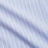 View 4 of product The Turnbull & Asser Blue Multi Stripe Cotton Regular Fit Whitby Shirt features white vertical stripes, long sleeves, button-down front, pointed collar, and buttoned cuffs, shown laid flat on a white background.