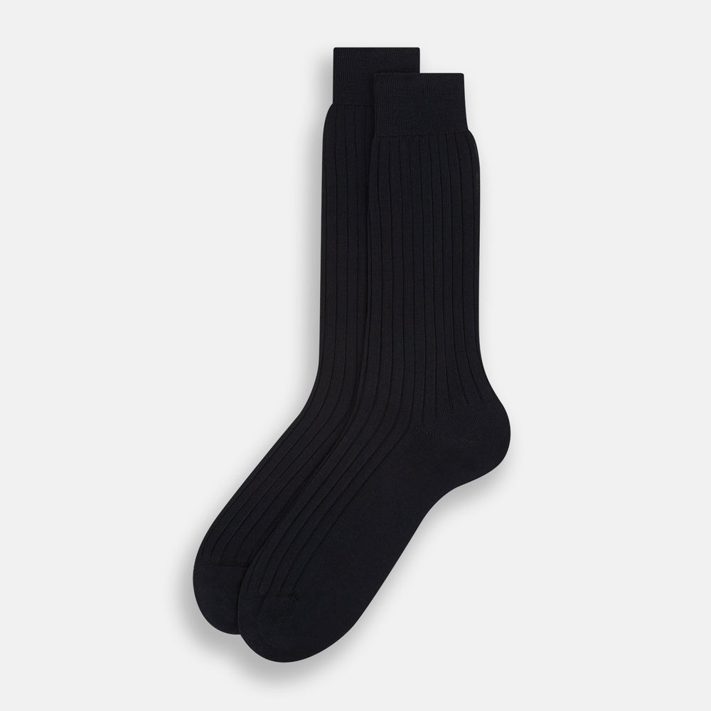 A single Midnight Thick Knit Mid-Length Sock by Turnbull & Asser, crafted from black mercerised Egyptian cotton, is shown in side profile against a plain white background with the toe pointing left.
