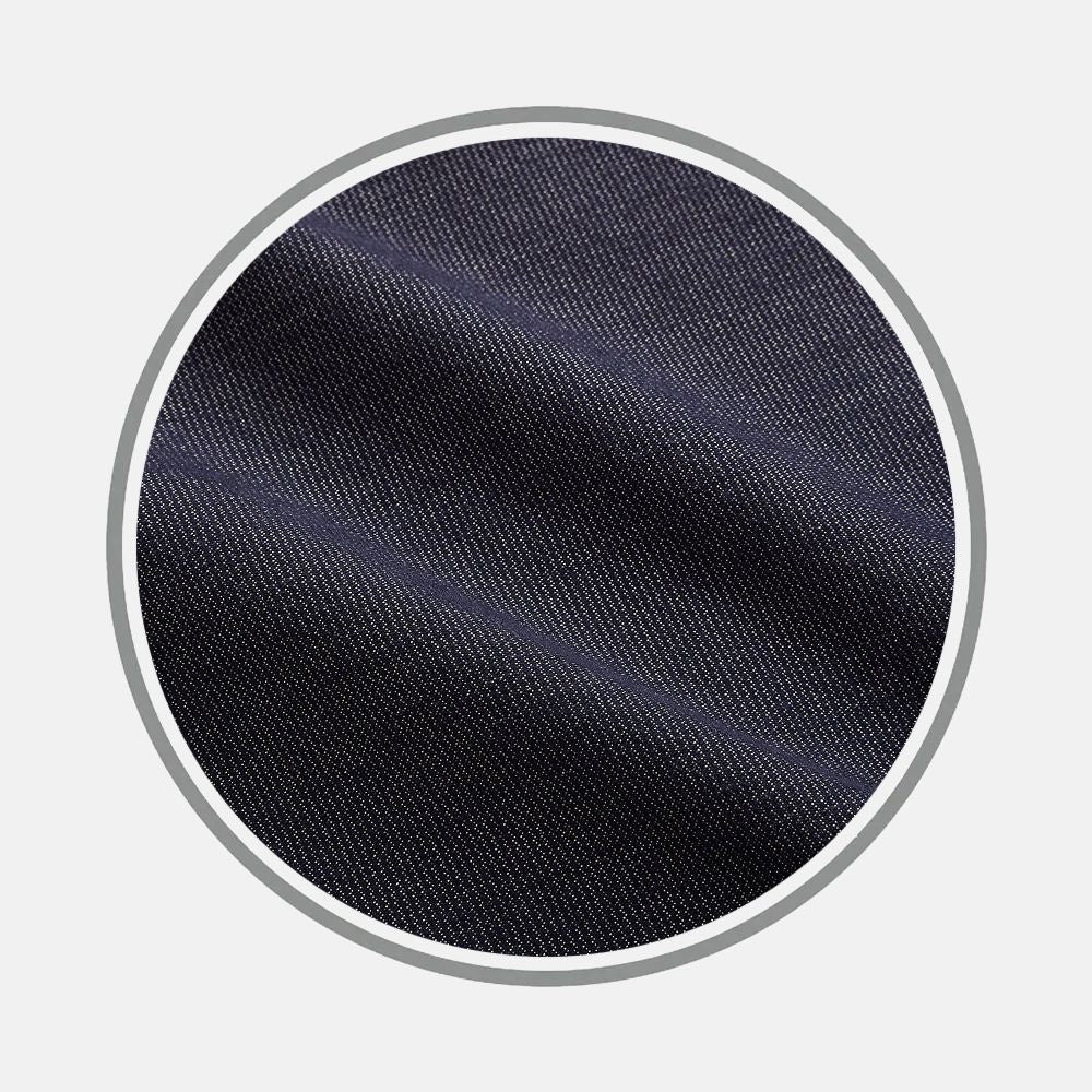 Close-up of Turnbull & Asser’s Navy Hampstead Fabric, highlighting its dark navy blue color and diagonal twill weave pattern, displayed within a circular frame on a light gray background.