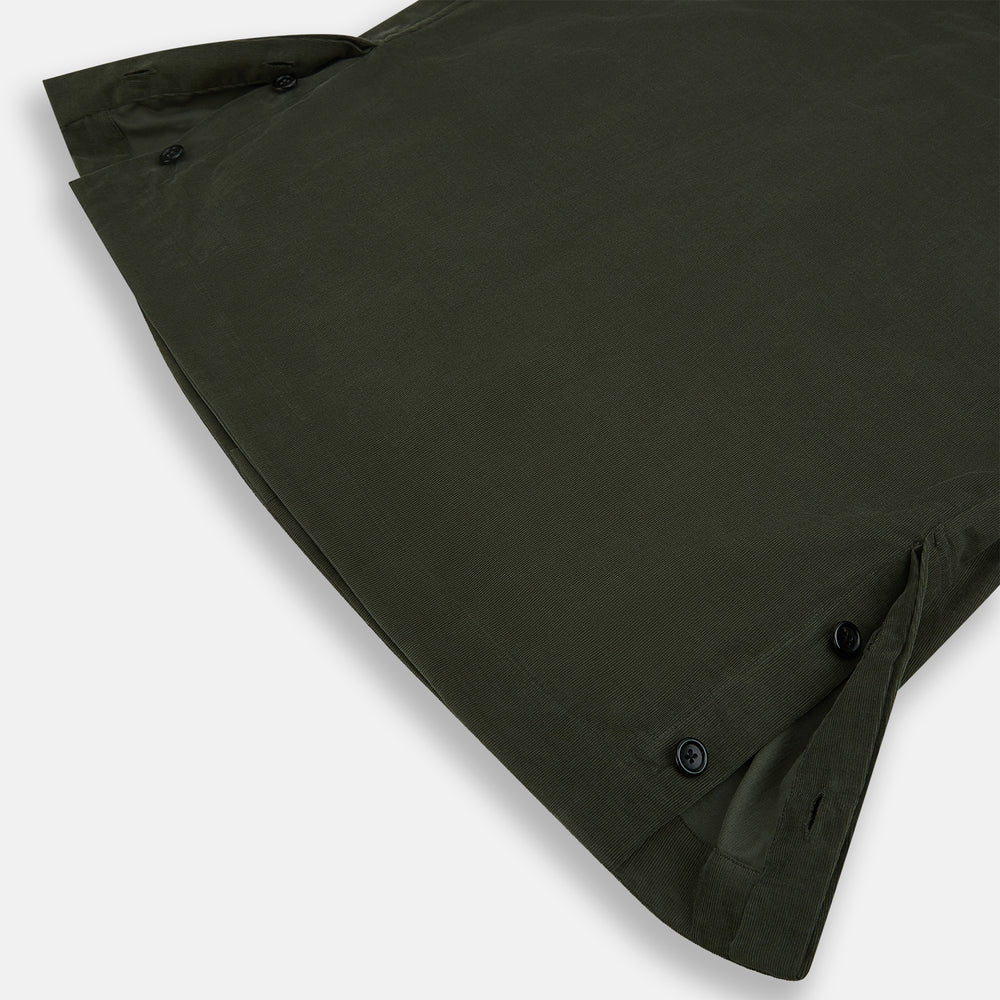 The Turnbull & Asser Olive Corduroy Hampstead Overshirt for men features a collar, long sleeves, left chest pocket, and two zippered side pockets, shown laid flat on a white background.