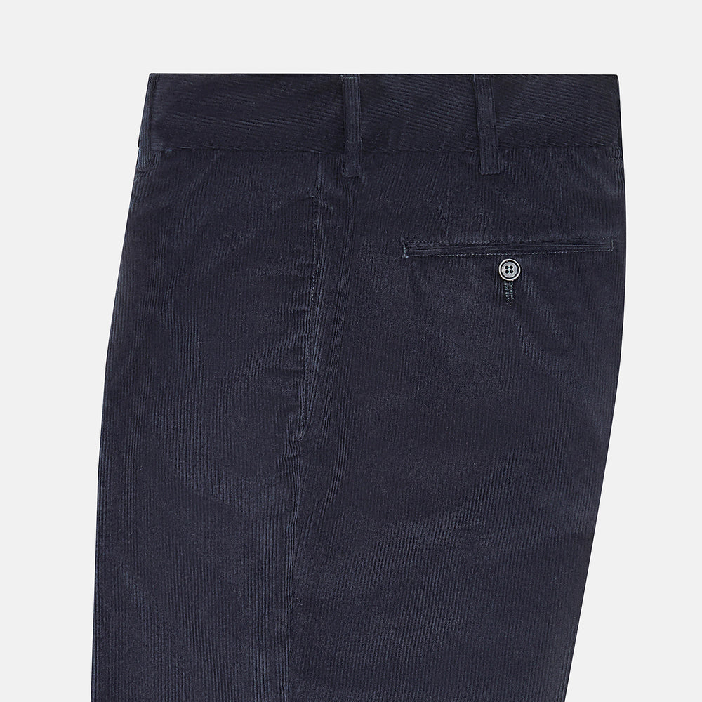 Turnbull & Asser’s Navy Corduroy Edward Trousers feature a straight-leg cut, button closure, and side pockets, shown on a plain white background.