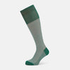 View 1 of product Turnbull & Asser Melon Green/White Thin Striped Long Sock features melon green and white vertical stripes with a solid green toe, heel, and cuff, shown singly against a plain light background.