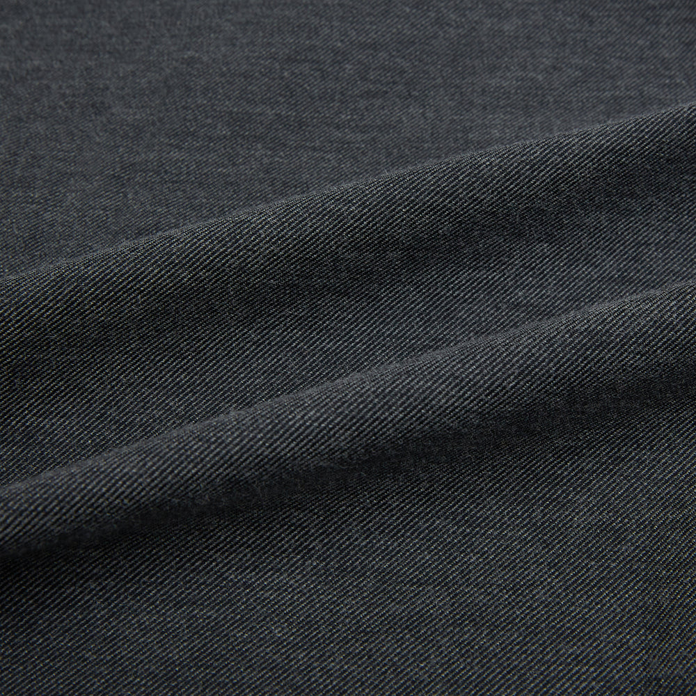 The Charcoal Melange Westminster Shirt by Turnbull & Asser features a long-sleeve, button-up design with a Turnbull collar and buttoned cuffs, offering classic British craftsmanship in a timeless style.