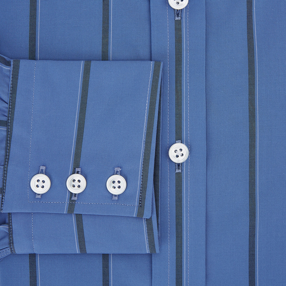 The Turnbull & Asser Colony Blue Track Stripe Mayfair Shirt is crafted from Italian cotton with long sleeves, dark blue track stripes, a classic collar, and buttoned cuffs, shown against a white background.