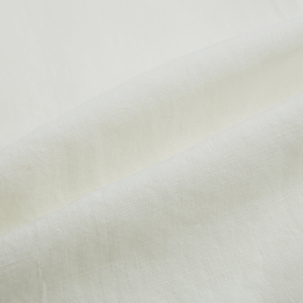 The Vanilla Linen Westminster Shirt by Turnbull & Asser is a long-sleeve, white button-up with a Turnbull collar, buttoned cuffs, and straight hem, highlighting British craftsmanship against a plain white background.