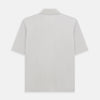View 3 of product The Turnbull & Asser Pale Pink Polo Shirt is a cotton jersey short-sleeve polo with a collar, three brown buttons on the placket, and a button-flap chest pocket, shown against a white background.