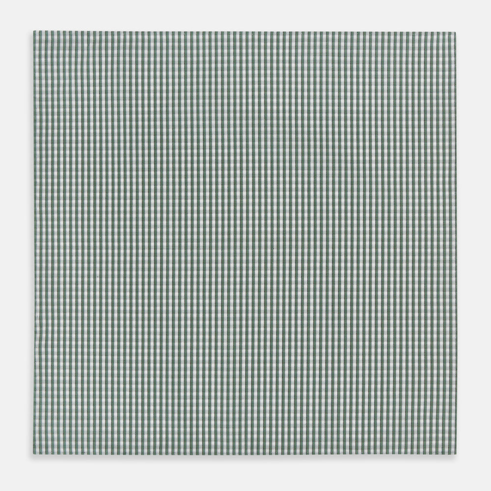 The Turnbull & Asser Melon Green Micro Shadow Check Hand-Rolled Handkerchief is displayed flat against a white background, showcasing its green and white check pattern and expertly hand-rolled edges.