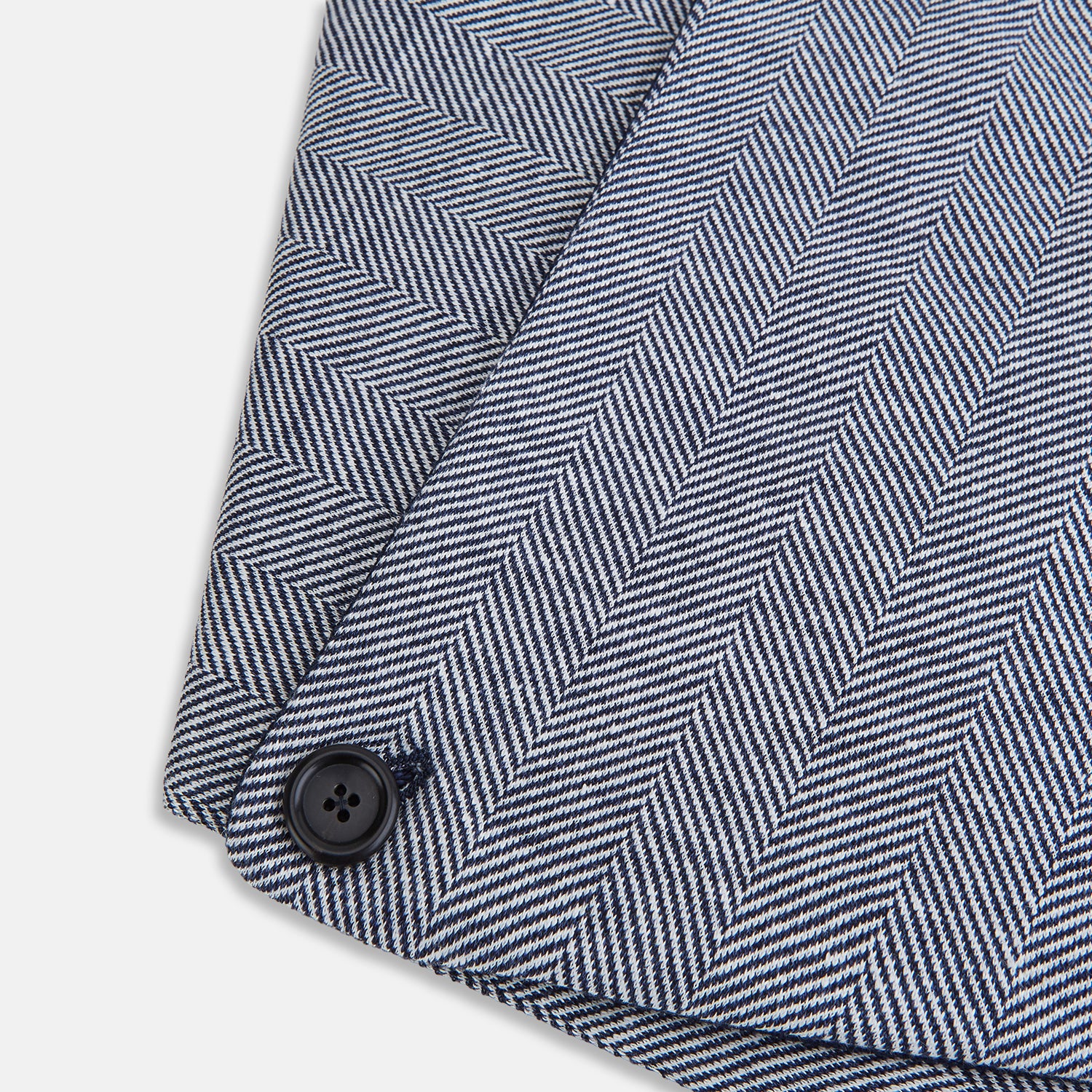 Image 4 of product The Turnbull & Asser Navy Herringbone Silk and Linen Neck Warmer features a grey and white pattern, button closure, and dark navy lining—a refined formal accessory for any wardrobe.