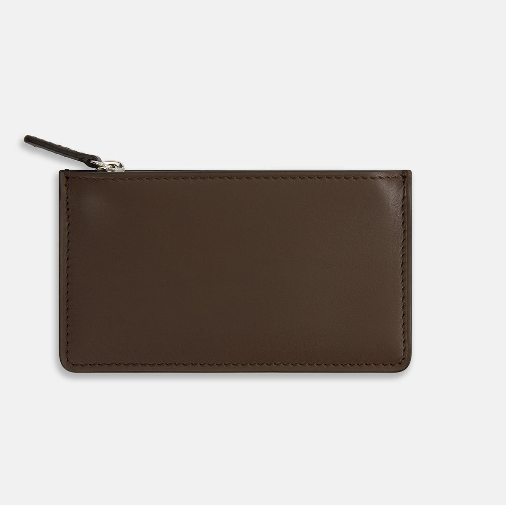The Dark Chocolate Leather Zip Wallet by Turnbull & Asser, crafted from full-grain Italian leather, features a white brand logo on the front and is displayed against a plain white background.