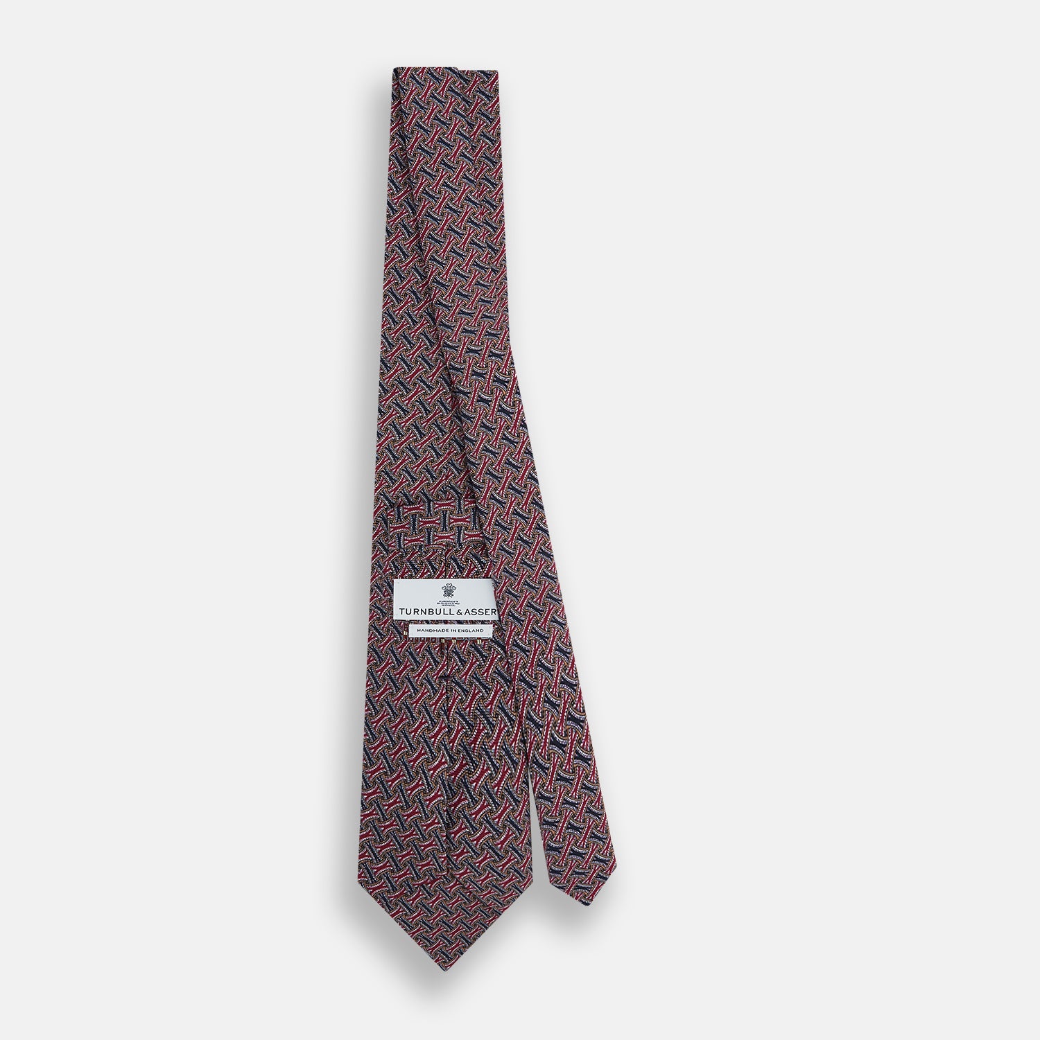 View 4 of product The Turnbull & Asser Burgundy and Navy Weave-Patterned Printed Silk Tie features an intricate geometric design, shown rolled on a plain white background.