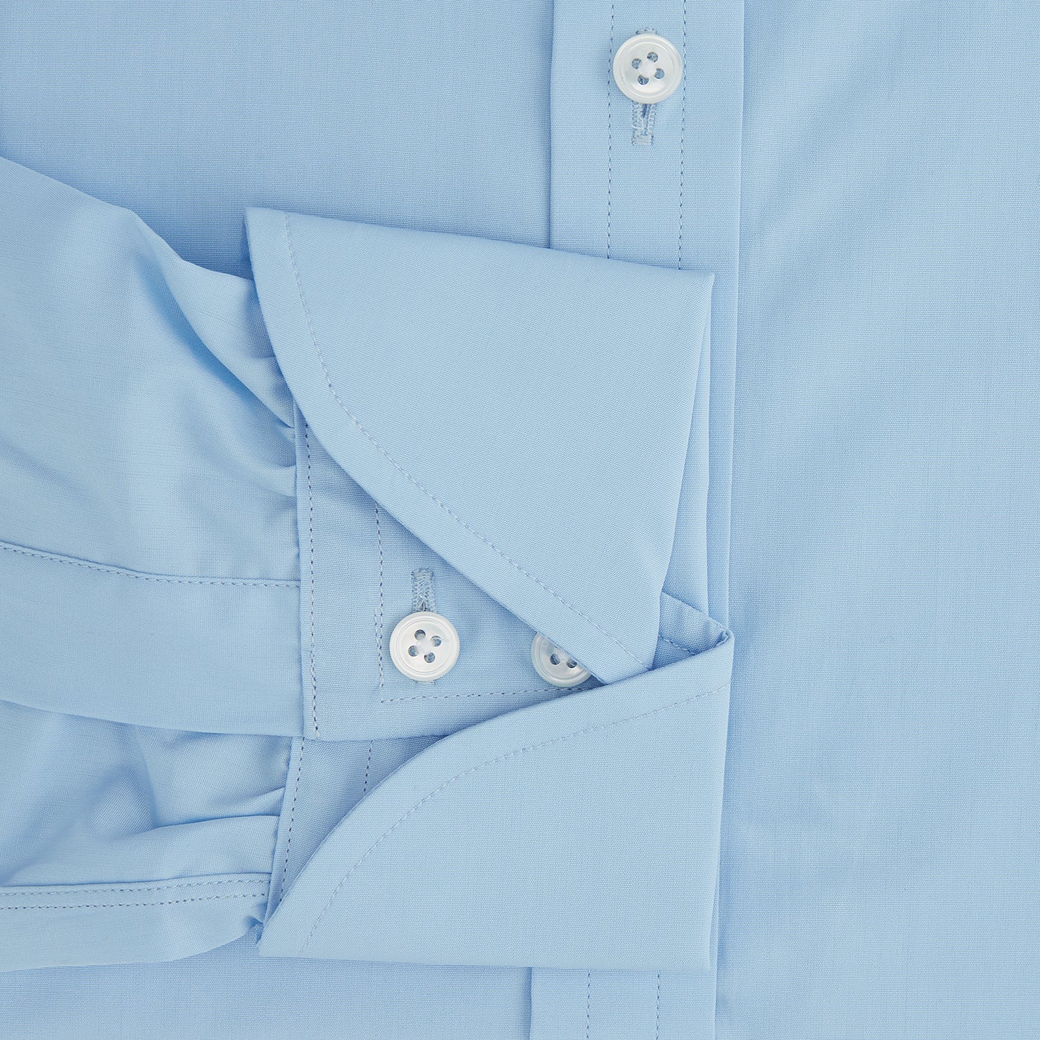 View 3 of product The Turnbull & Asser Dr. No Blue Cotton Shirt with a classic collar, cocktail cuffs, button-up front, and straight hem is featured on a plain white background. As seen on James Bond.
