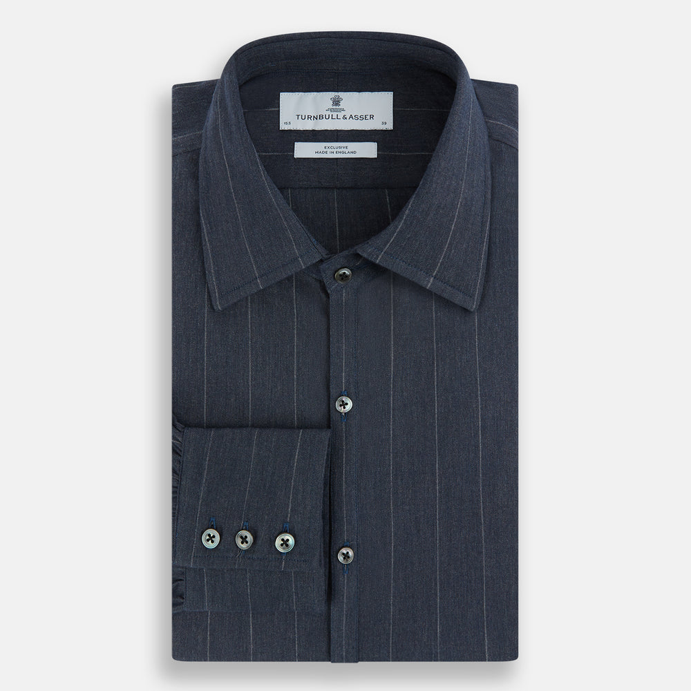 The Turnbull & Asser Navy Melange Wide Stripe Westminster Shirt features a classic collar, buttoned cuffs, and a tailored fit, showcasing British craftsmanship. Laid flat on a white background.