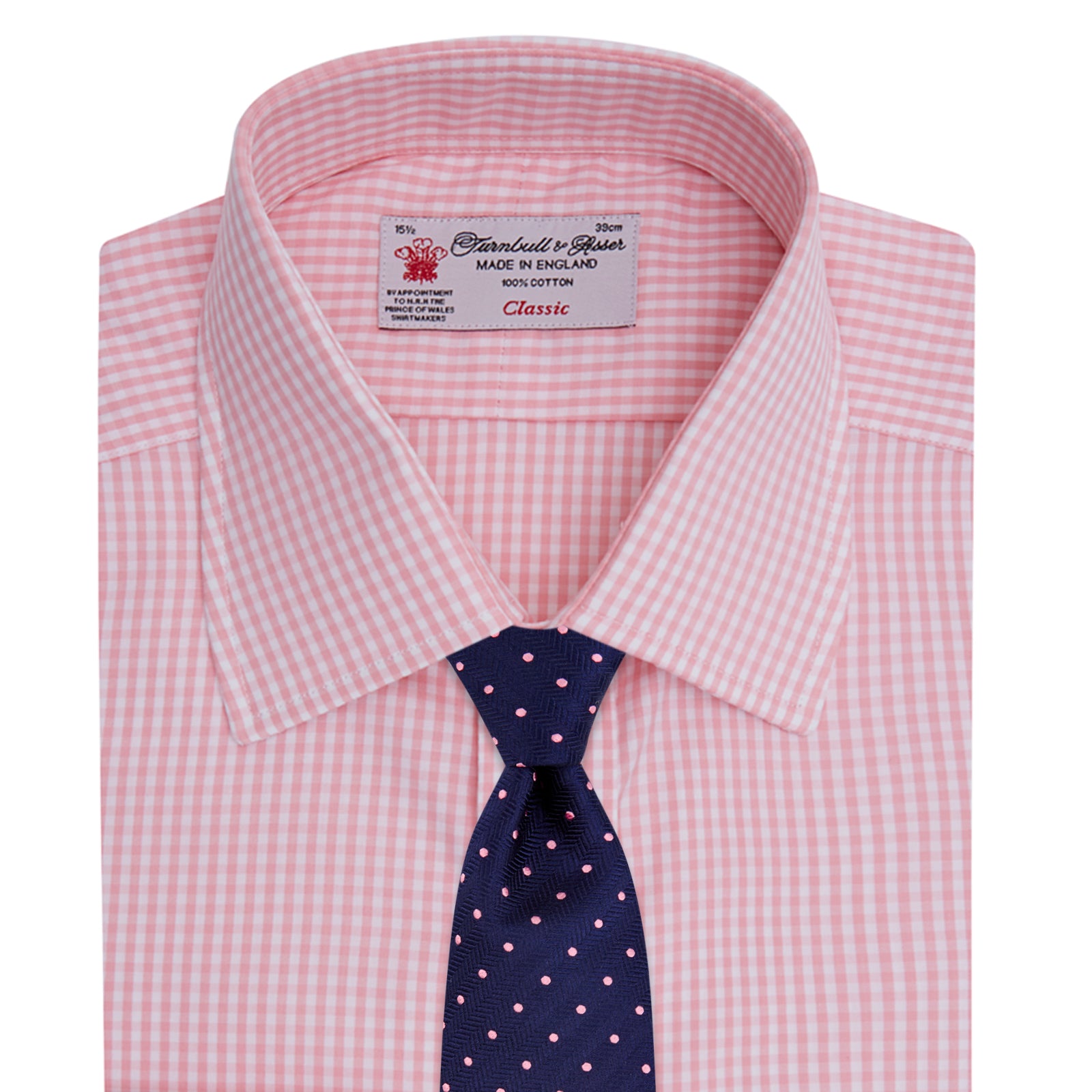 View 4 of product The Turnbull & Asser Light Pink Gingham Check Shirt features a classic T&A collar, 3-button cuffs, and white buttons, neatly folded on a plain white background.