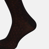 View 4 of product A single Turnbull & Asser Navy/Red Polka Dot Long Sock, crafted from mercerised Egyptian cotton, is displayed against a plain white background.