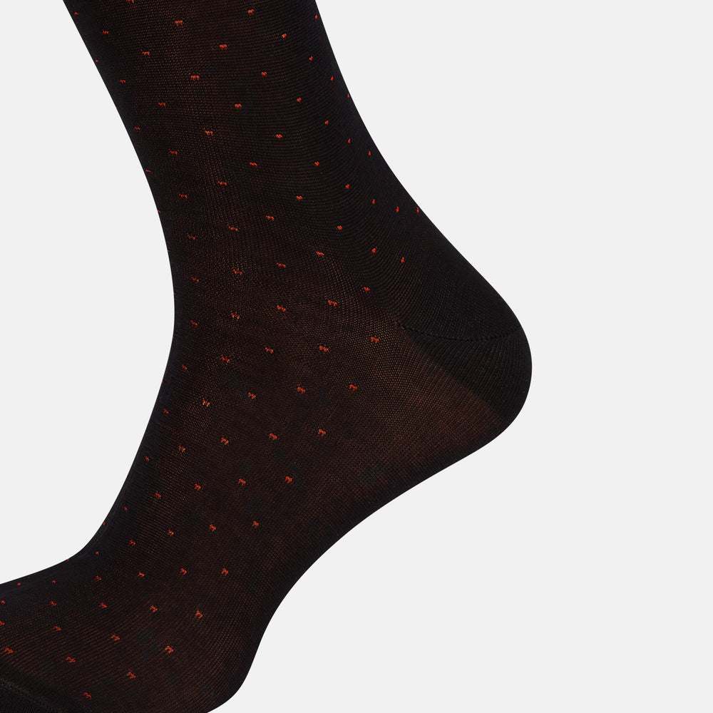A single Turnbull & Asser Navy/Red Polka Dot Long Sock, crafted from mercerised Egyptian cotton, is displayed against a plain white background.