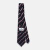 View 4 of product The Turnbull & Asser Red And Blue Stripe Silk Blend Tie, rolled on a white background, features refined diagonal accents—an elegant formal accessory.