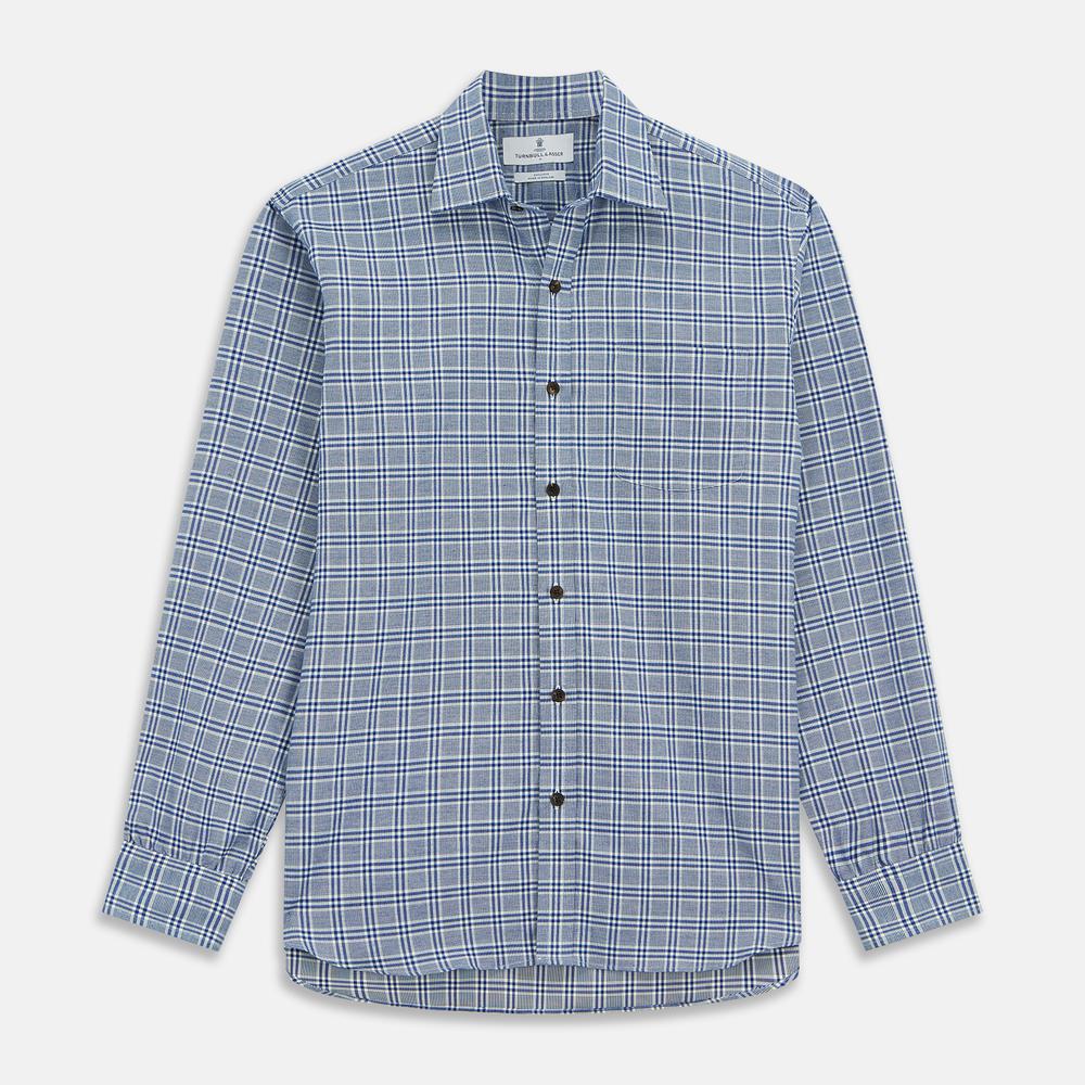 Close-up of Turnbull & Asser Blue Check Cotton Fabric, featuring a woven blue and white plaid pattern with intersecting lines and small white squares, displayed within a circular frame.