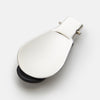 View 2 of product The Turnbull & Asser Navy Travel Shoe Horn features a wide, smooth silver blade and a navy leather-wrapped handle, shown against a plain white background.
