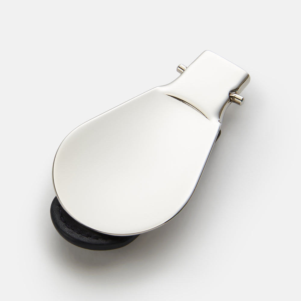The Turnbull & Asser Navy Travel Shoe Horn features a wide, smooth silver blade and a navy leather-wrapped handle, shown against a plain white background.