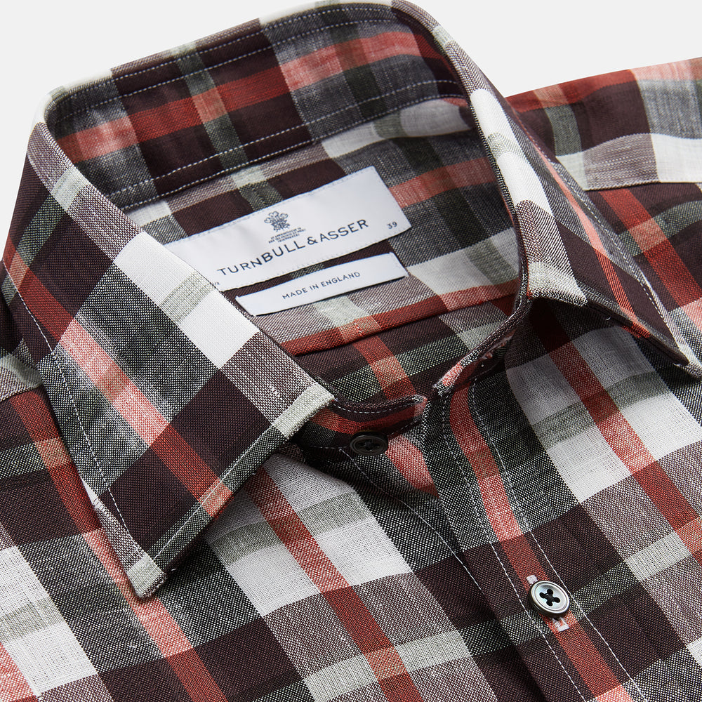The Turnbull & Asser Black Multi-check Linen Blend Regular Fit Mayfair Shirt features long sleeves, a classic T&A collar and cuffs, and a black-and-red check pattern, shown on a white background.