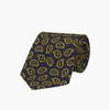 View 2 of product The Navy and Gold Petal Paisley Silk Tie by Turnbull & Asser features a repeating yellow abstract pattern, neatly rolled on a white background.