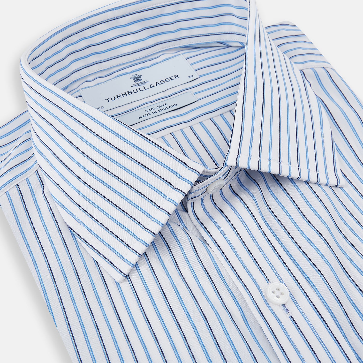 View 2 of product The Blue and Navy Double Stripe Mayfair Shirt by Turnbull & Asser features a classic T&A collar and thin blue stripes on a white background, displayed against a plain white surface.