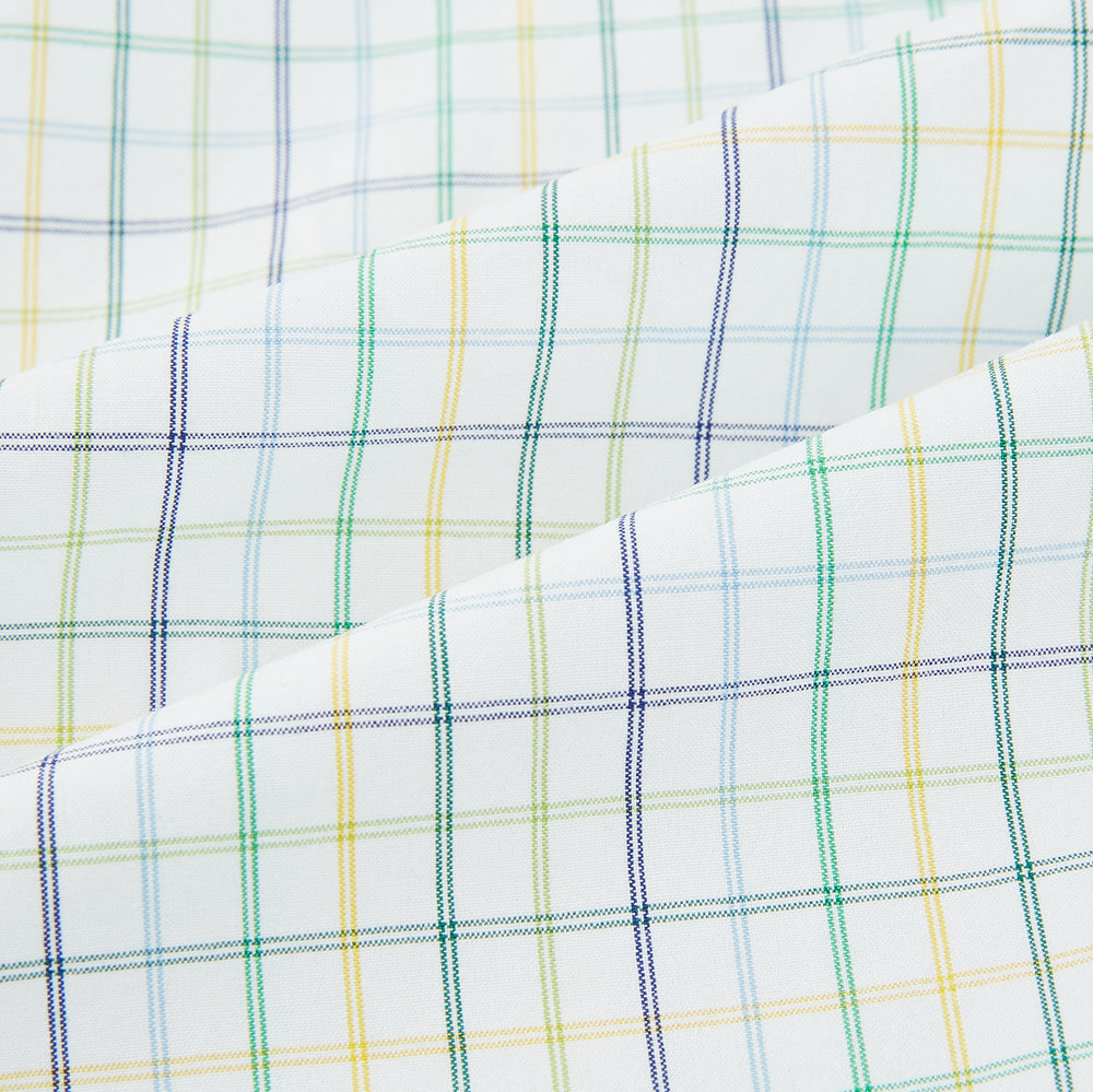 The Turnbull & Asser Multi Tone Double Grid Check Mayfair Shirt is a long-sleeve, button-up with a classic collar, showcasing pure cotton light blue, green, and yellow grid checks on white, neatly displayed flat against a white surface.