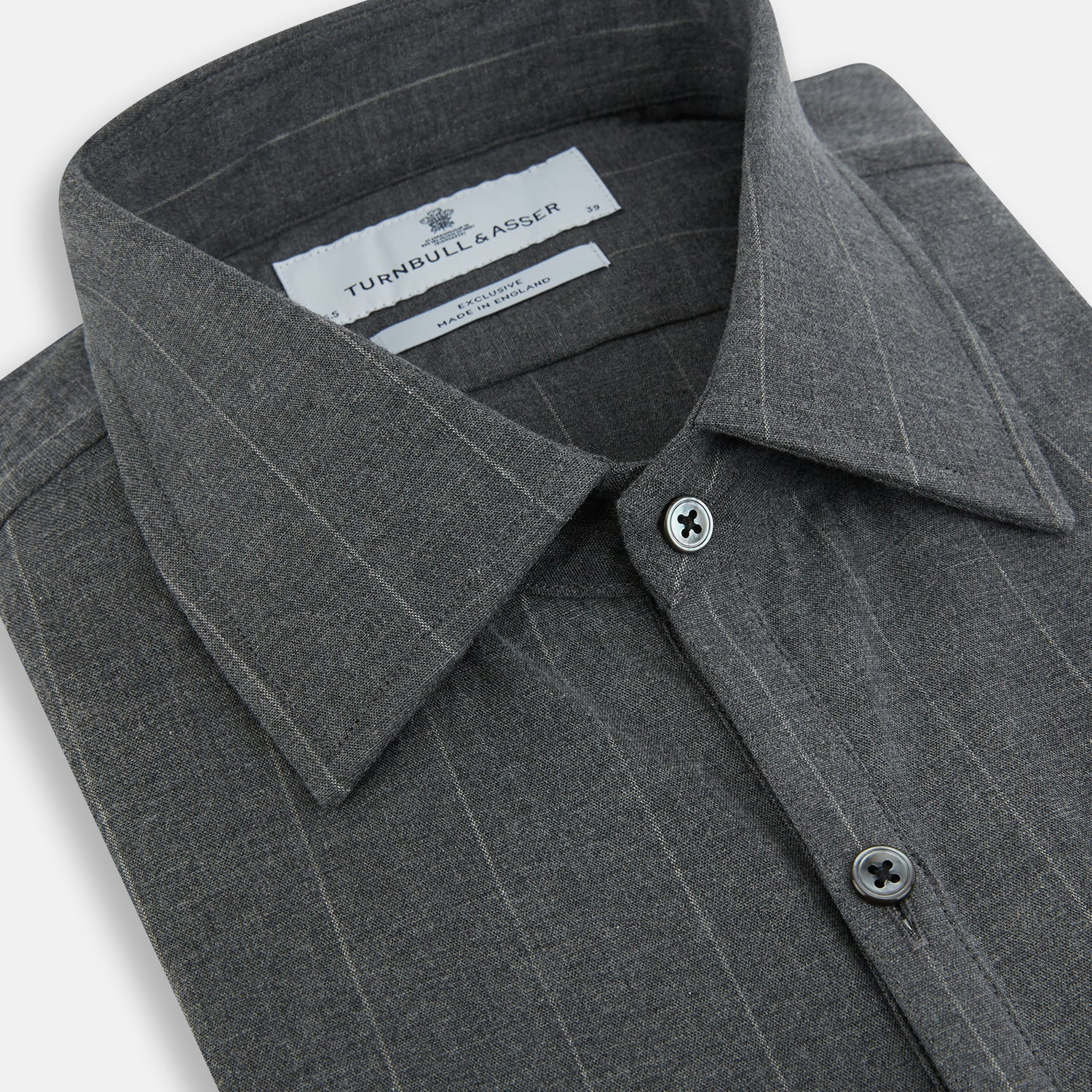 View 2 of product The Charcoal Melange Wide Stripe Westminster Shirt from Turnbull & Asser features long sleeves, a tailored fit, pointed collar, buttoned cuffs, and subtle wide stripes, shown laid flat on a white background.