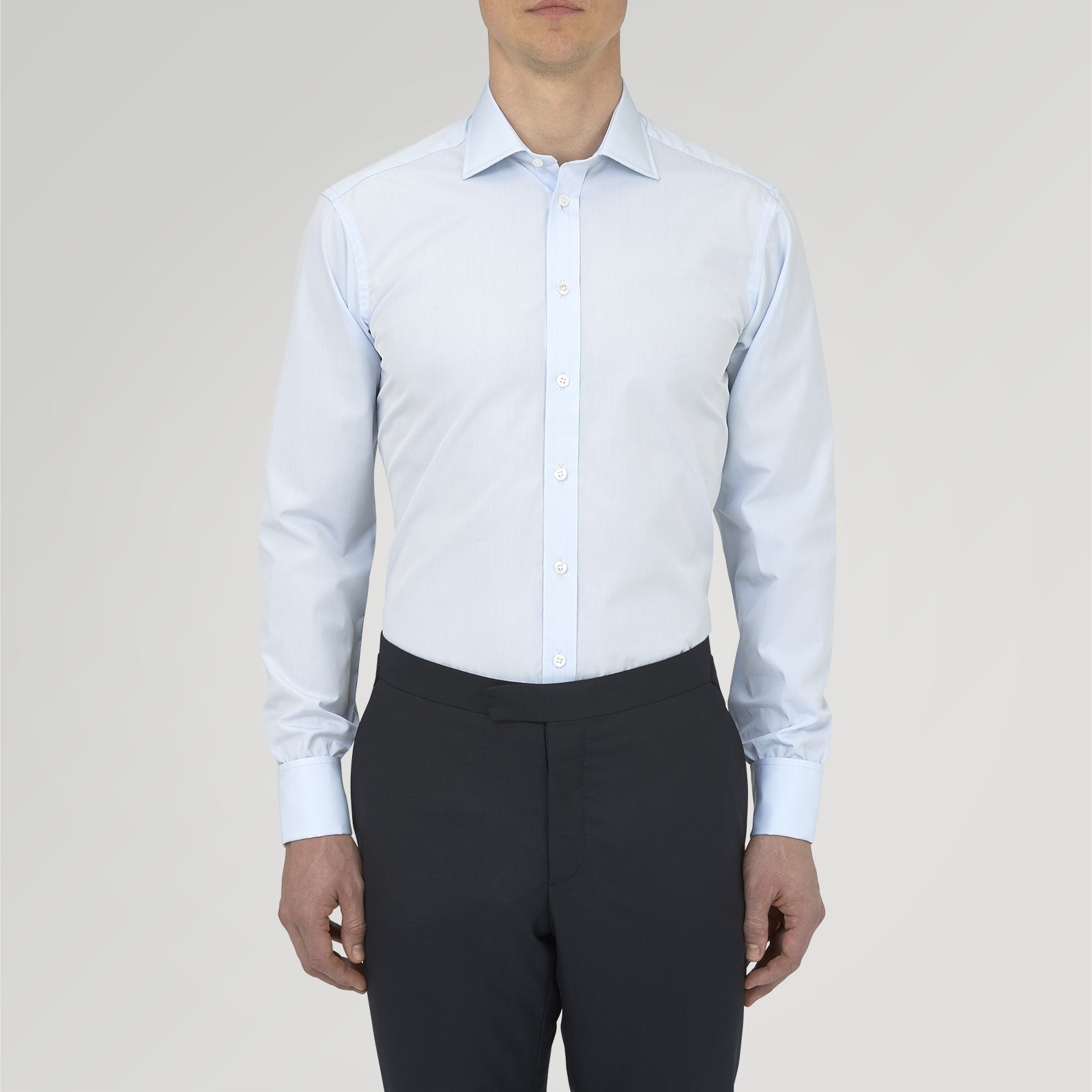 View 2 of product A neatly folded Turnbull & Asser Two-Fold 120 Light Blue Shirt, featuring a regent collar and double cuffs, is displayed against a plain white background.